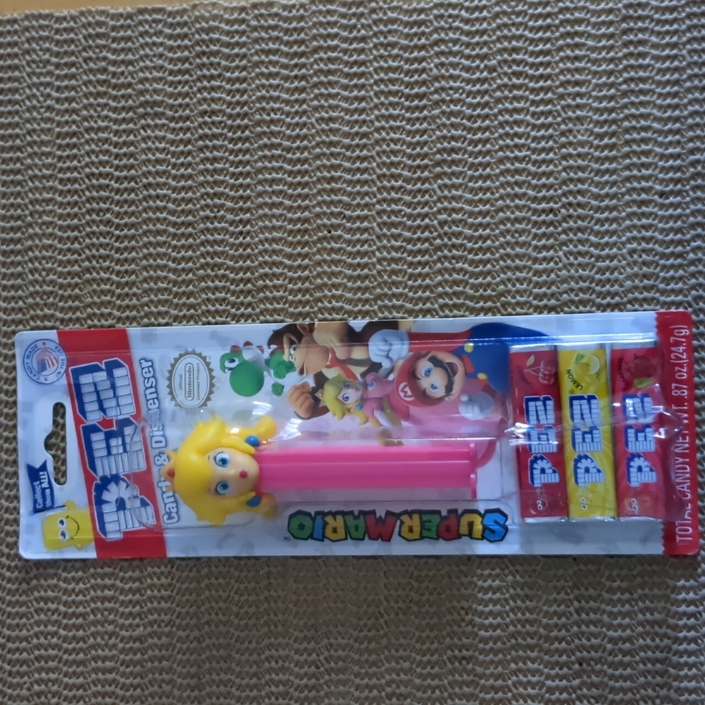 Pez dispenser w/ candy " princess peach" from Super Mario New